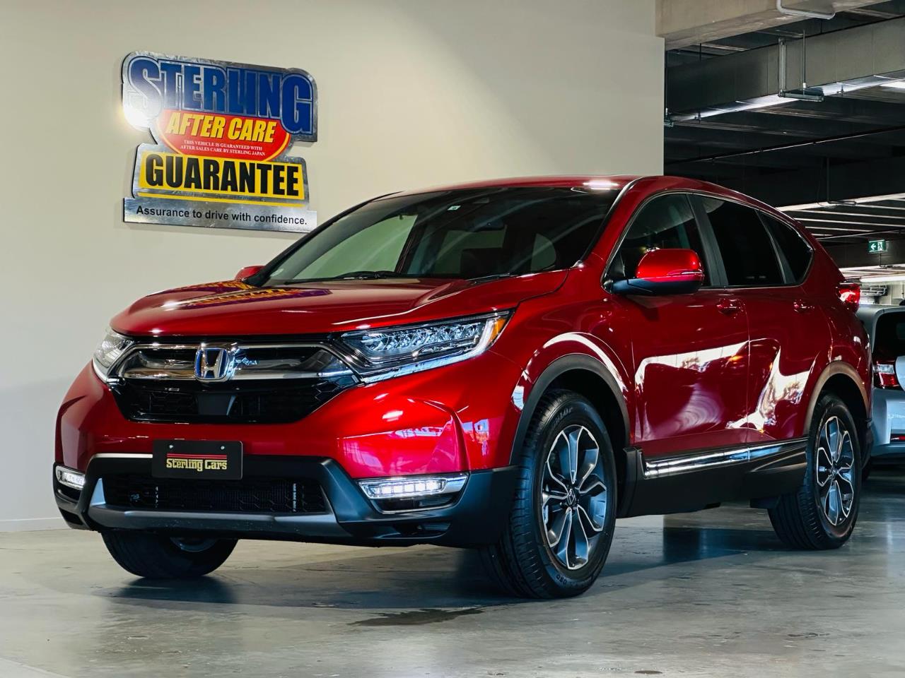 2022 Honda CR-V e:HEV EX Masterpiece in Red front three-quarter
